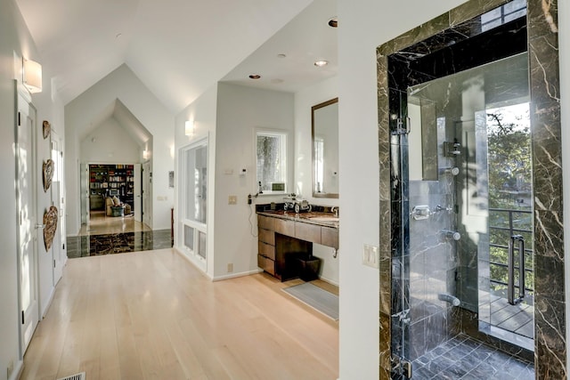 2003 Arrowwood Cir N, Houston, TX 77063 - full bathroom featuring a shower stall, baseboards, recessed lighting, wood finished floors, and vanity