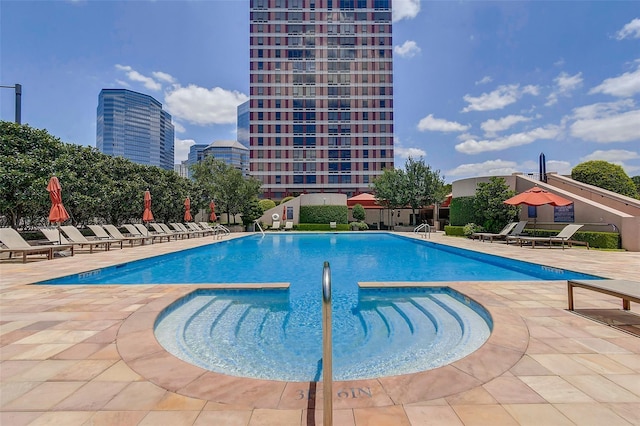 pool featuring a patio area