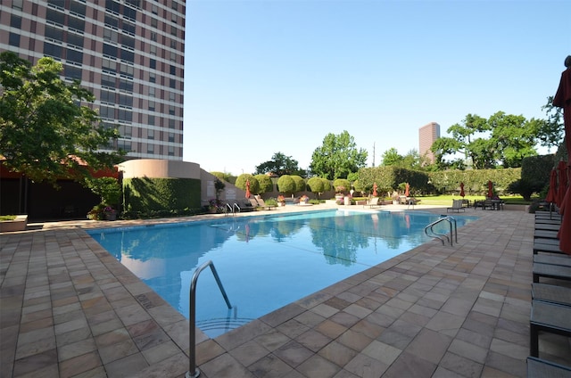 community pool featuring a patio area