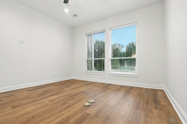 25927 Hunter Ln, Katy, TX 77494 - empty room with wood finished floors, visible vents, baseboards, and a ceiling fan
