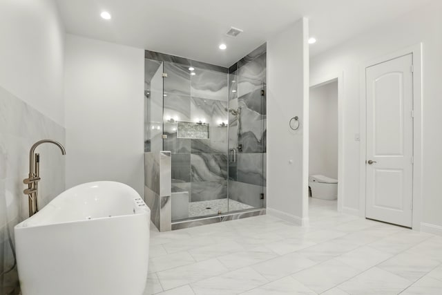 25927 Hunter Ln, Katy, TX 77494 - bathroom featuring recessed lighting, baseboards, marble finish floor, a shower stall, and a freestanding bath
