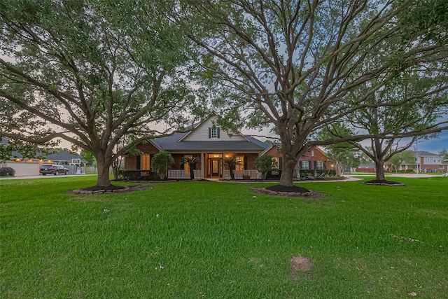 view of front of home featuring a porch and a front yard