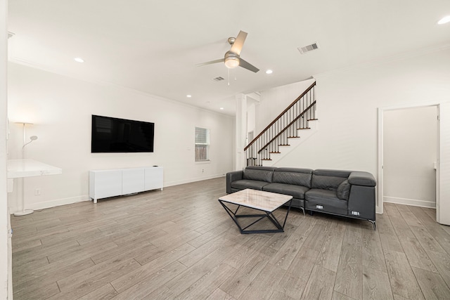 living area featuring light wood finished floors, ornamental molding, recessed lighting, and ceiling fan