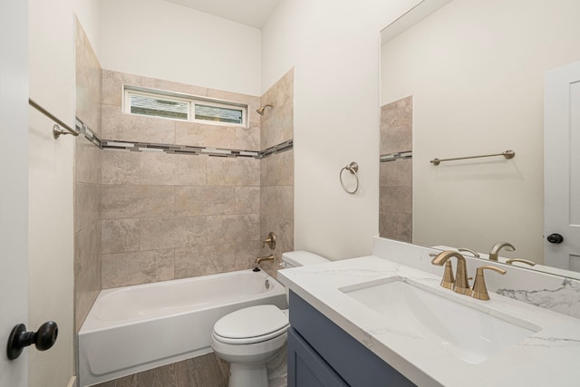 bathroom with toilet, vanity, wood finished floors, and bathing tub / shower combination
