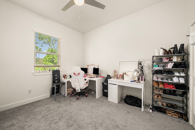 carpeted home office with baseboards and ceiling fan