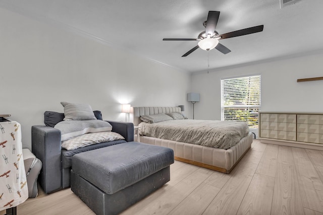 bedroom featuring light wood-style flooring and ceiling fan
