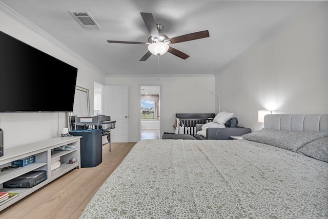 bedroom featuring crown molding, a ceiling fan, light wood-style flooring, and visible vents