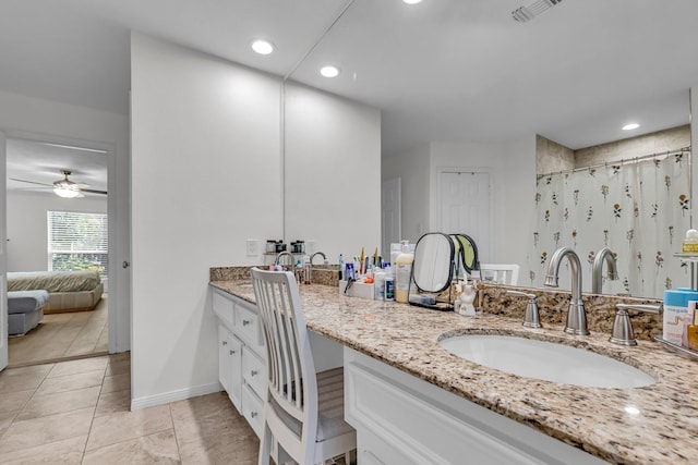 ensuite bathroom with visible vents, vanity, ensuite bathroom, ceiling fan, and tile patterned floors