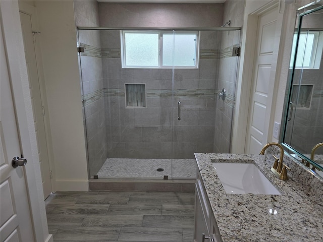 2140 De Soto St, Houston, TX 77091 - bathroom featuring baseboards, a shower stall, and vanity