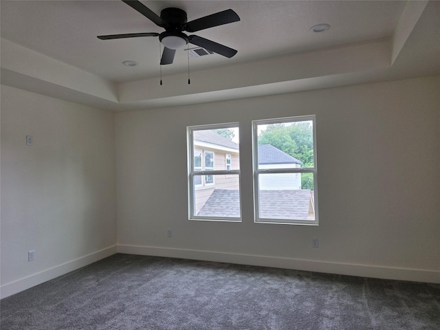 2140 De Soto St, Houston, TX 77091 - spare room featuring baseboards, dark carpet, and a ceiling fan