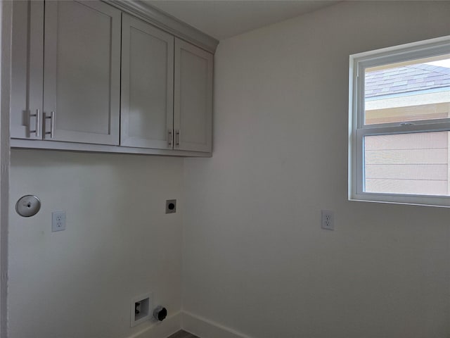 2140 De Soto St, Houston, TX 77091 - washroom featuring hookup for an electric dryer, cabinet space, and baseboards