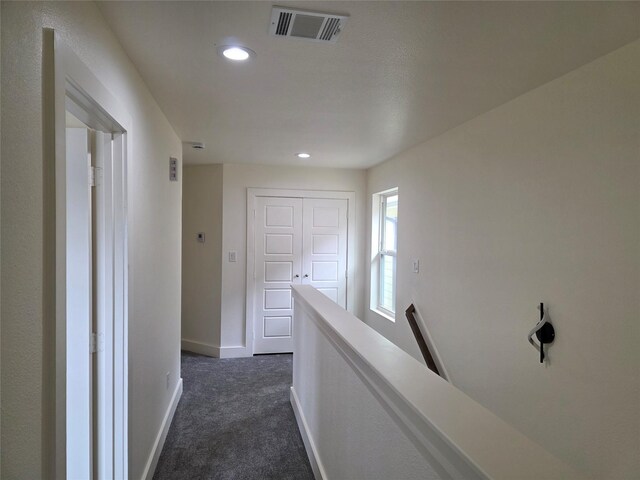2140 De Soto St, Houston, TX 77091 - corridor featuring baseboards, visible vents, dark carpet, and recessed lighting
