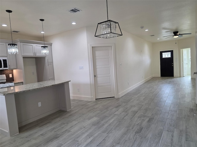 2140 De Soto St, Houston, TX 77091 - kitchen with visible vents, white appliances, baseboards, light wood-type flooring, and open floor plan