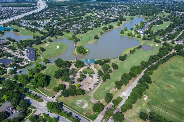 bird's eye view featuring a water view and golf course view