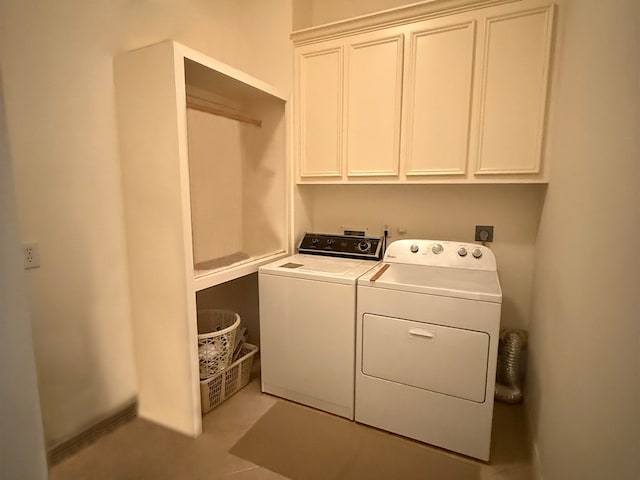 washroom featuring cabinet space and washer and dryer