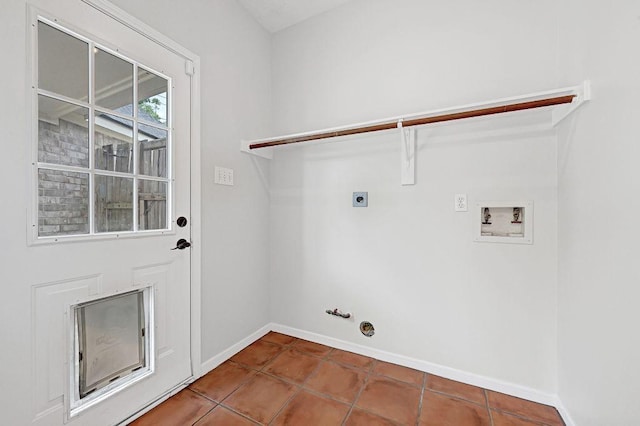 clothes washing area with laundry area, gas dryer hookup, baseboards, electric dryer hookup, and washer hookup