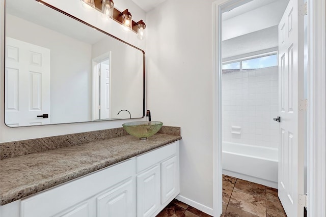 bathroom with baseboards and vanity