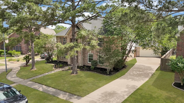 view of front of house featuring brick siding and a front yard