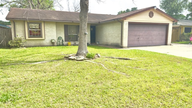 ranch-style home with brick siding, a front lawn, concrete driveway, and a garage