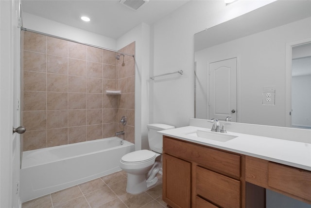 bathroom featuring tile patterned flooring, shower / washtub combination, visible vents, toilet, and vanity