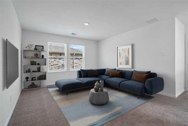 carpeted living room featuring baseboards and visible vents