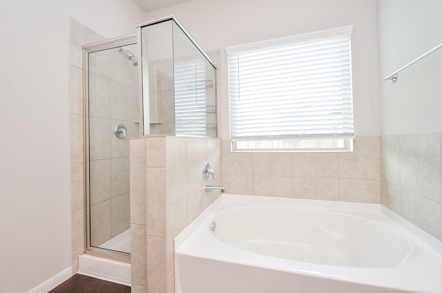 24430 Vittorio Wood Ln, Katy, TX 77493 - full bath featuring a shower stall, a bath, and wood finished floors