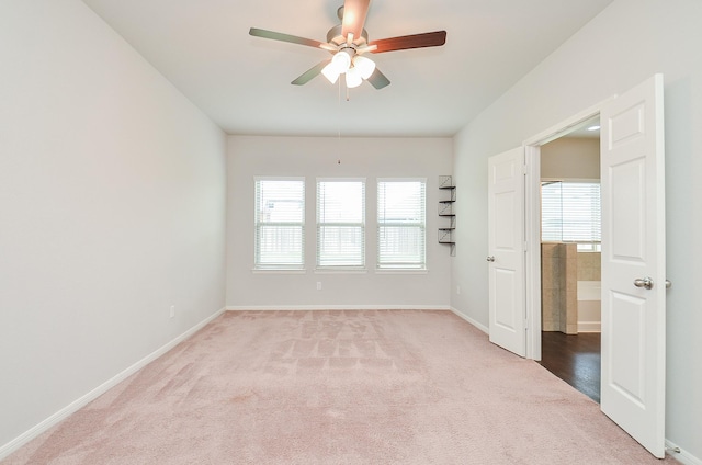 24430 Vittorio Wood Ln, Katy, TX 77493 - unfurnished room featuring light carpet, baseboards, and ceiling fan