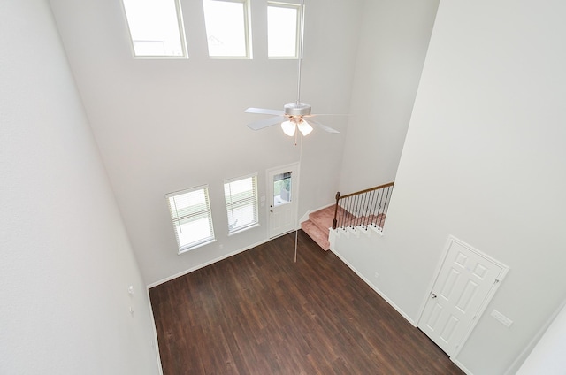 24430 Vittorio Wood Ln, Katy, TX 77493 - entryway featuring a towering ceiling, dark wood-type flooring, stairway, and ceiling fan