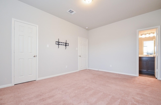 24430 Vittorio Wood Ln, Katy, TX 77493 - unfurnished bedroom with light colored carpet, baseboards, and connected bathroom