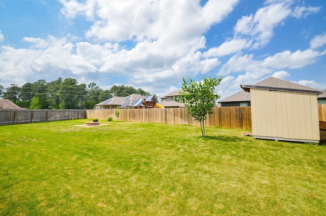 24430 Vittorio Wood Ln, Katy, TX 77493 - view of yard with an outdoor fire pit