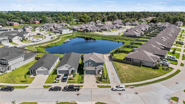 aerial view featuring a residential view and a water view