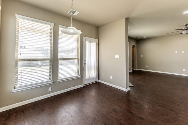 3713 Daisy Ln, Huntsville, TX 77340 - spare room featuring wood finished floors, a ceiling fan, visible vents, and arched walkways