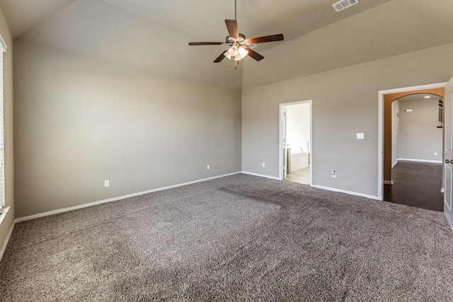 3713 Daisy Ln, Huntsville, TX 77340 - unfurnished bedroom with connected bathroom, arched walkways, carpet floors, baseboards, and visible vents
