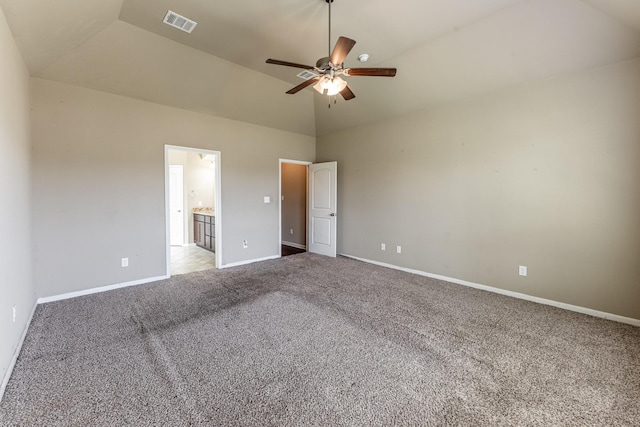 3713 Daisy Ln, Huntsville, TX 77340 - unfurnished bedroom with visible vents, light colored carpet, baseboards, high vaulted ceiling, and ensuite bathroom