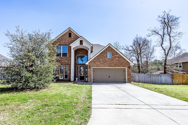 3713 Daisy Ln, Huntsville, TX 77340 - traditional home featuring concrete driveway, fence, a front yard, a garage, and brick siding