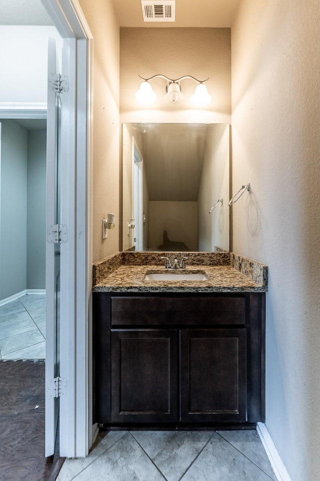 3713 Daisy Ln, Huntsville, TX 77340 - bathroom featuring baseboards, visible vents, and vanity