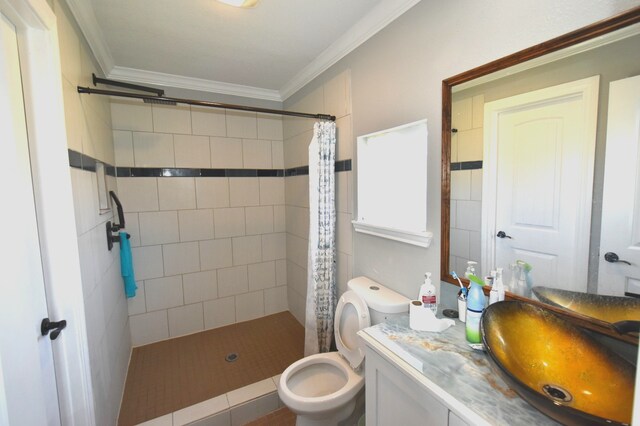 504 Cedar St, Sweeny, TX 77480 - full bathroom with vanity, ornamental molding, a tile shower, and toilet