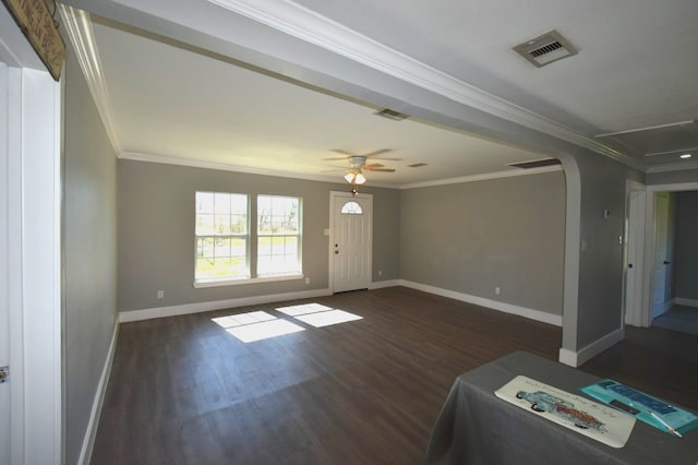 504 Cedar St, Sweeny, TX 77480 - unfurnished living room with baseboards, crown molding, arched walkways, and wood finished floors
