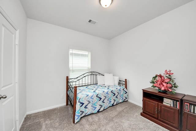 carpeted bedroom with baseboards and visible vents