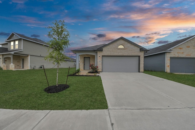 ranch-style home featuring an attached garage, stone siding, a front yard, and driveway