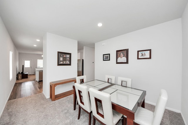dining space with recessed lighting, carpet, and baseboards