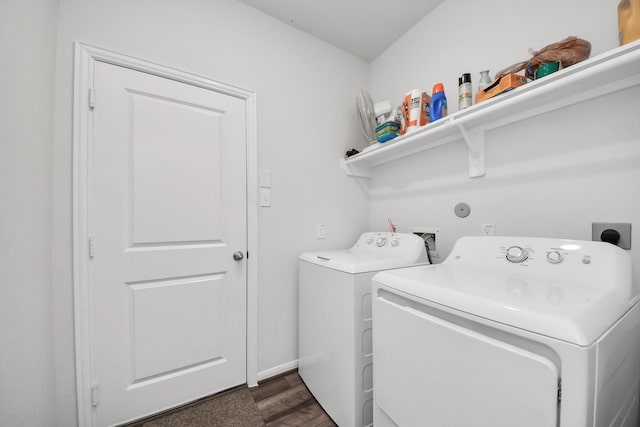washroom featuring independent washer and dryer, laundry area, and dark wood-style flooring