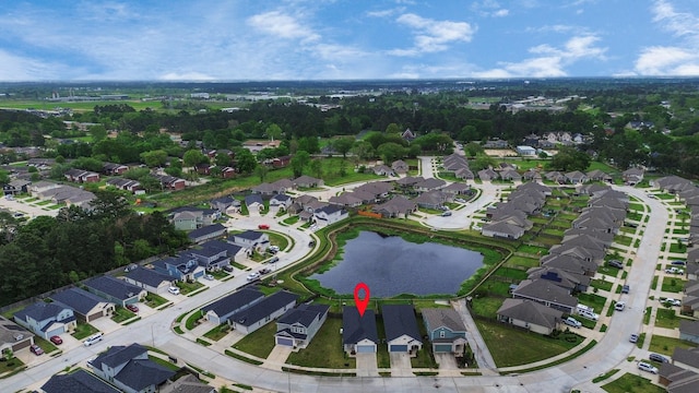 birds eye view of property featuring a water view and a residential view