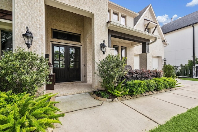 6605 Rolla St, Houston, TX 77055 - property entrance with a porch, french doors, and brick siding