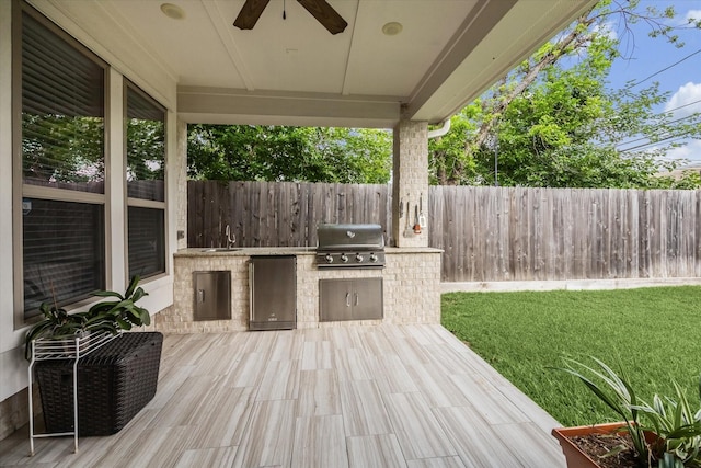 6605 Rolla St, Houston, TX 77055 - wooden terrace featuring area for grilling, grilling area, a yard, a ceiling fan, and a fenced backyard