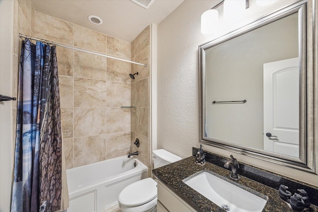 8207 Mesquite Hill Ln, Richmond, TX 77469 - full bathroom featuring vanity, toilet, a textured wall, and shower / tub combo