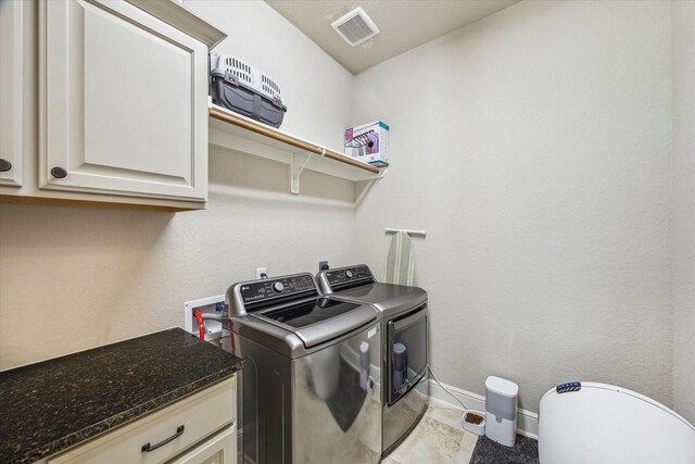 8207 Mesquite Hill Ln, Richmond, TX 77469 - washroom with separate washer and dryer, baseboards, cabinet space, and visible vents