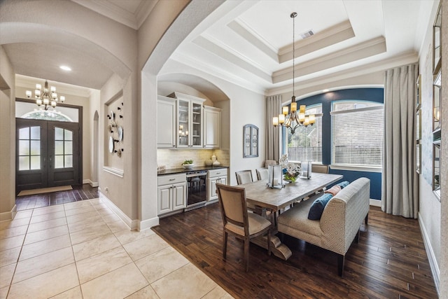 8207 Mesquite Hill Ln, Richmond, TX 77469 - dining area featuring wine cooler, baseboards, french doors, and a chandelier