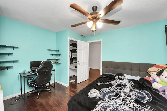 bedroom with wood finished floors, baseboards, and ceiling fan