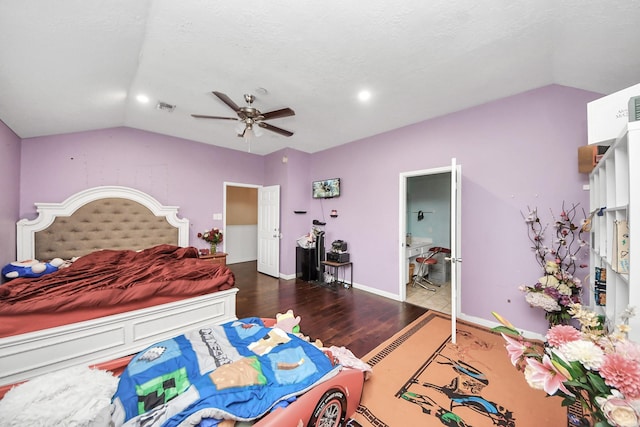bedroom with vaulted ceiling, visible vents, a ceiling fan, wood finished floors, and baseboards